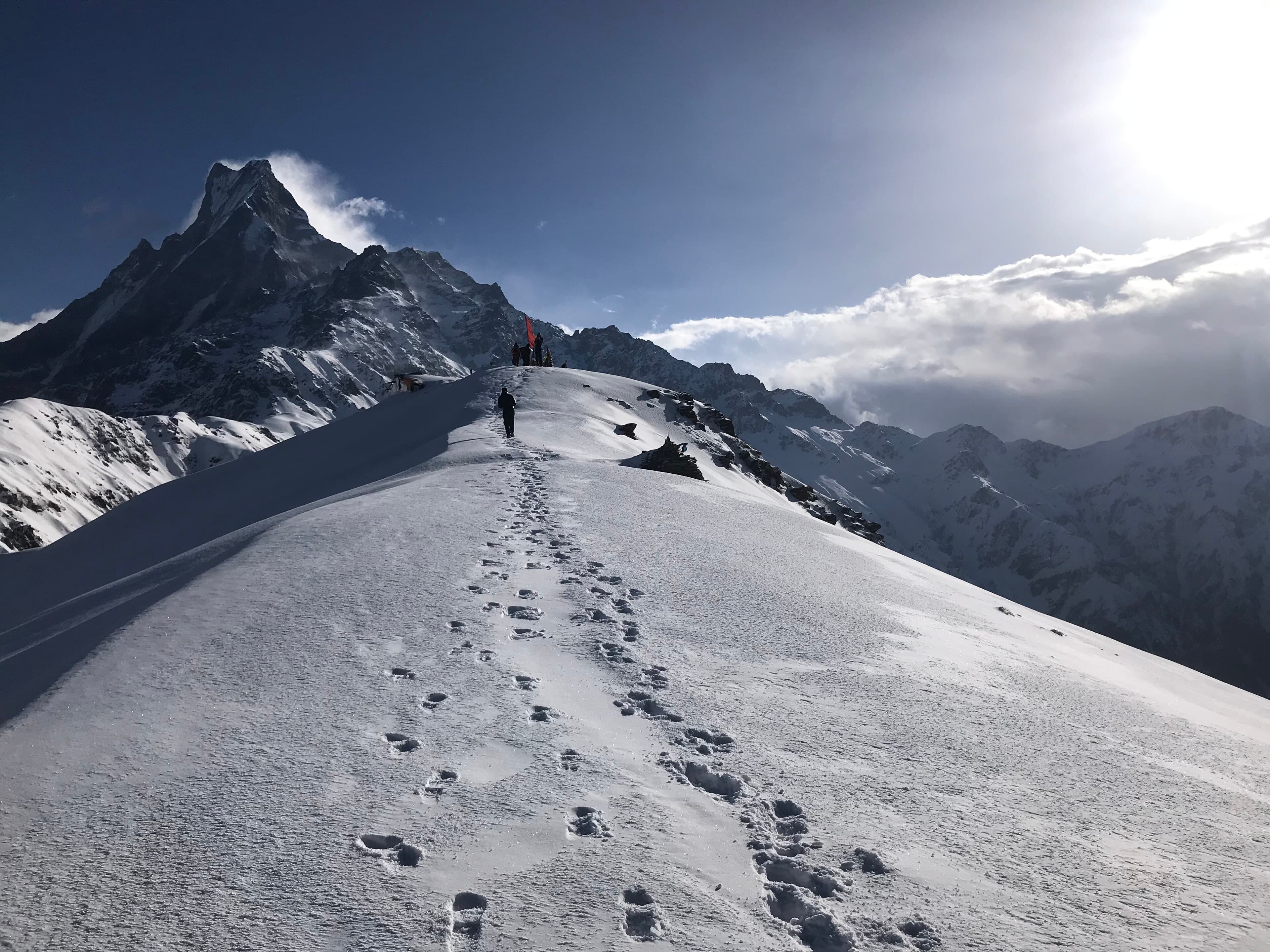 Footprints in fresh snow on the ridge to Mardi Himal Base Camp